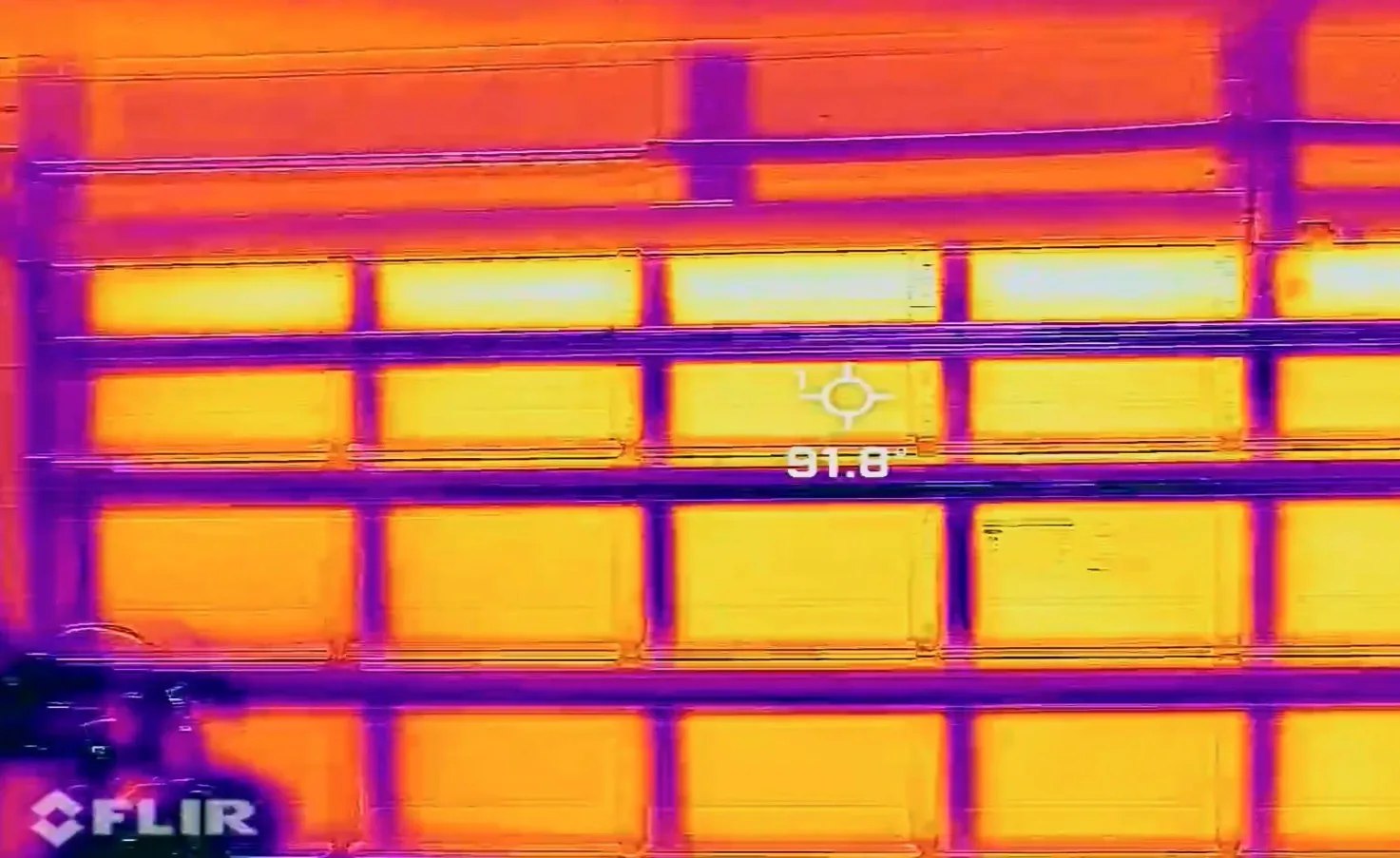 FLIR thermal image of uninsulated garage door showing high surface temperatures