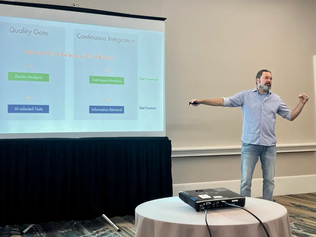 Dr. Elmar Jürgens presenting his four test-selection approaches at StarEast 2026